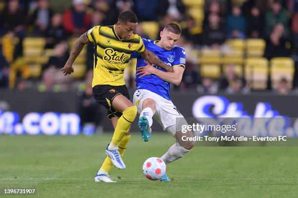 Vitalii Mykolenko of Everton and João Pedro challenge for the ball during the Premier League match between Watford and Everton at Vicarage Road on...