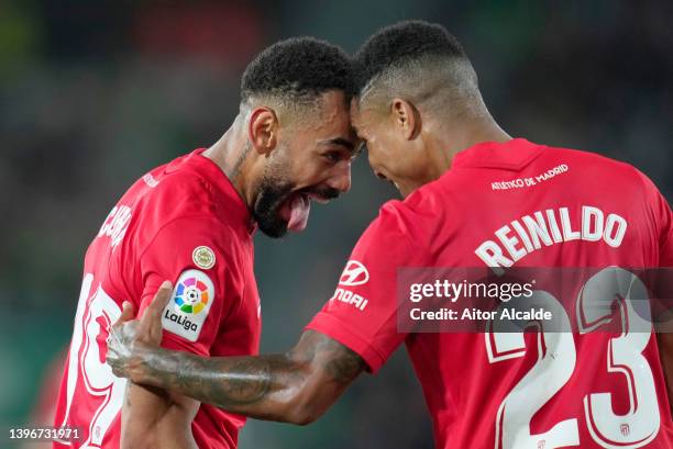 Matheus Cunha of Atletico Madrid celebrates with teammate Reinildo Mandava after scoring their side's first goal during the La Liga Santander match...