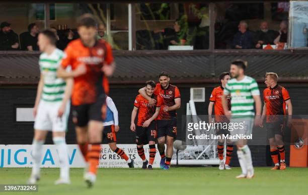 Dylan Levitt of Dundee United celebrates with teammate Tony Watt after scoring their side's first goal during the Cinch Scottish Premiership match...