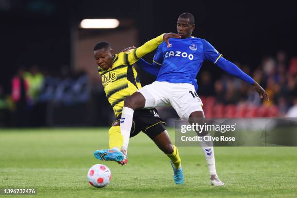 Samuel Kalu of Watford battles for possession with Abdoulaye Doucoure of Everton during the Premier League match between Watford and Everton at...