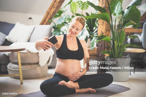 young happy and cheerful beautiful pregnant woman taking selfie with - baby body stock pictures, royalty-free photos & images