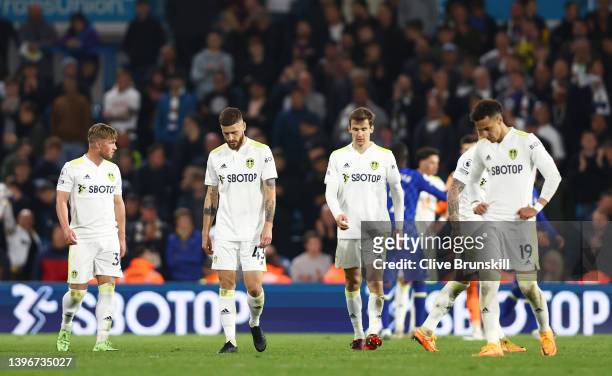Mateusz Klich, Diego Llorente and Rodrigo Moreno of Leeds United look dejected during the Premier League match between Leeds United and Chelsea at...