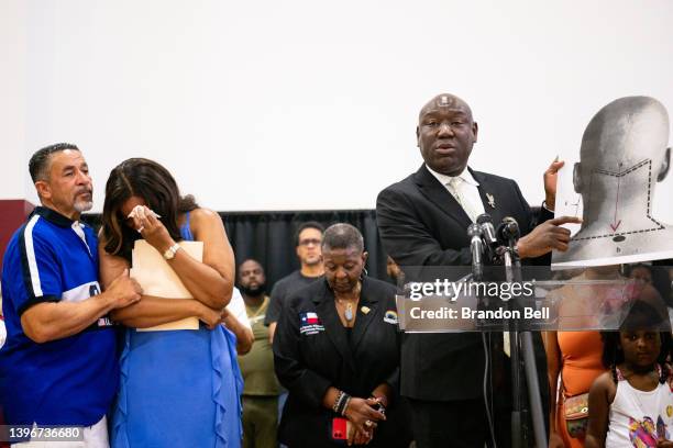 Attorney Ben Crump holds up a diagram explaining Jalen Ja'Von Randle's gunshot wound during a news conference on May 11, 2022 in Houston, Texas. The...