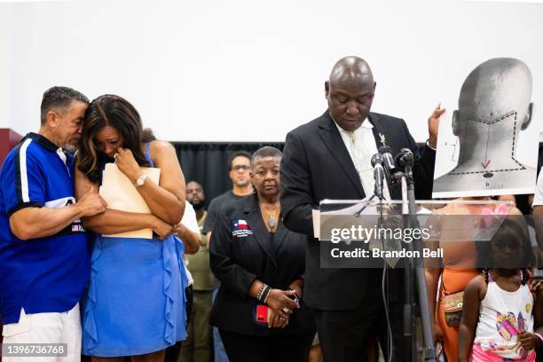 Attorney Ben Crump holds up a diagram explaining Jalen Ja'Von Randle's gunshot wound during a news conference on May 11, 2022 in Houston, Texas. The...