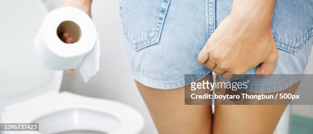 portrait of a woman suffers from diarrhea his stomach - woman hemorrhoids stock pictures, royalty-free photos & images