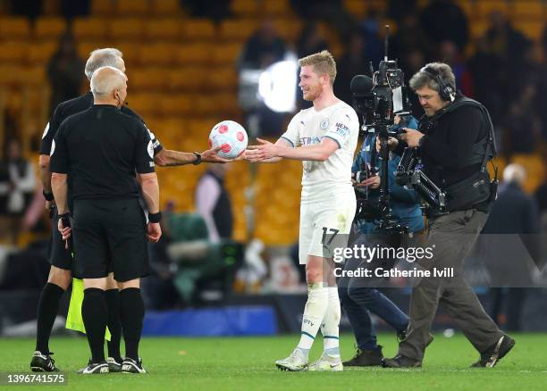Kevin De Bruyne of Manchester City is handed the match ball following their hat-trick by Match Referee, Martin Atkinson in the Premier League match...