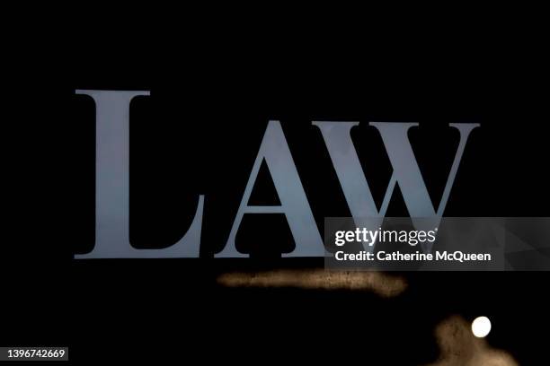 the word “law” in reflection of dark window - school arrest stock pictures, royalty-free photos & images