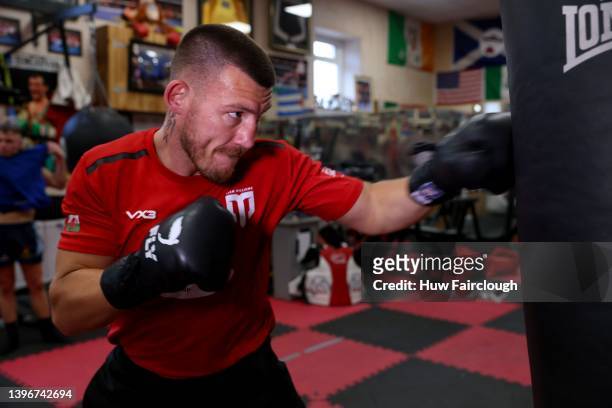 Welsh boxer Liam Williams training using the punch bags at his local boxing Gym on May 11, 2022 in Maerdy, Wales.