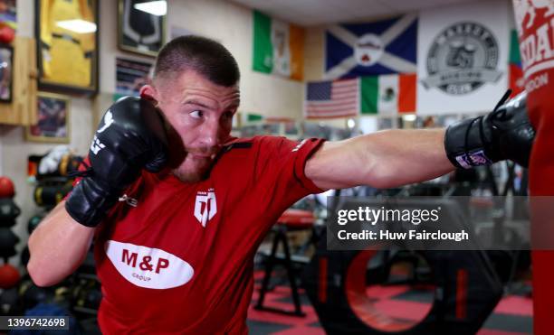 Welsh boxer Liam Williams training using the punch bags at his local boxing Gym on May 11, 2022 in Maerdy, Wales.