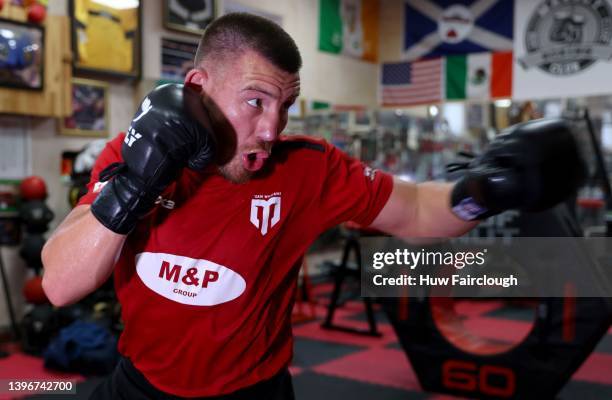 Welsh boxer Liam Williams training using the punch bags at his local boxing Gym on May 11, 2022 in Maerdy, Wales.