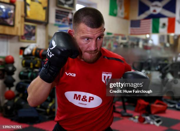 Welsh boxer Liam Williams training using the punch bags at his local boxing Gym on May 11, 2022 in Maerdy, Wales.