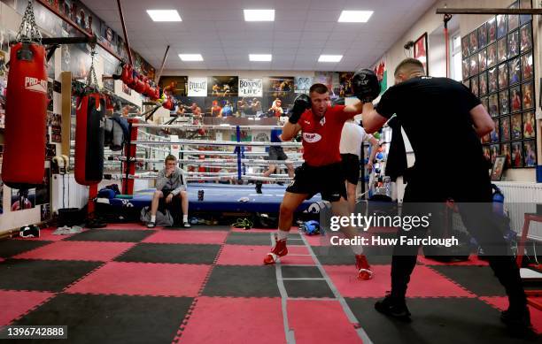 Boxer Liam Williams with his trainer Brett Parry during a training at his local boxing Gym on May 11, 2022 in Maerdy, Wales.