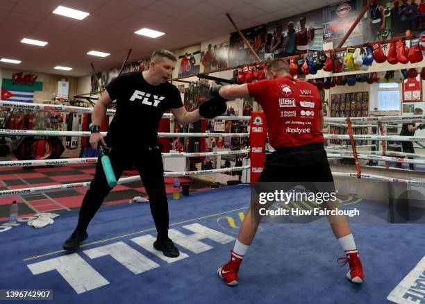 Boxer Liam Williams with his trainer Brett Parry during a training at his local boxing Gym on May 11, 2022 in Maerdy, Wales.