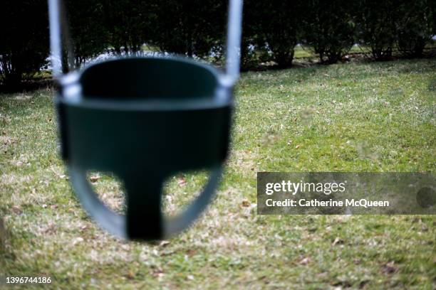 conceptual symbol: empty swing - play date ストックフォトと画像