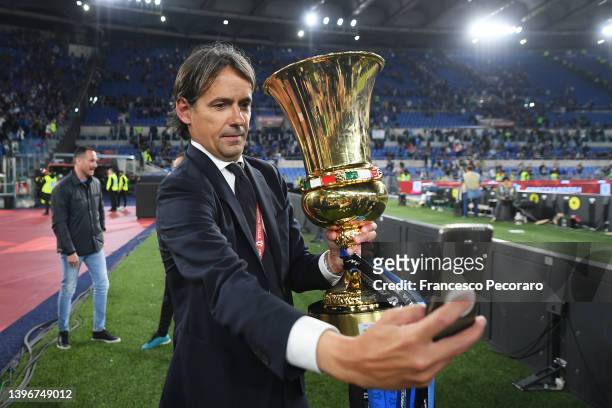 Simone Inzaghi, Head Coach of FC Internazionale celebrates with the Coppa Italia Trophy after victory in the Coppa Italia Final match between...
