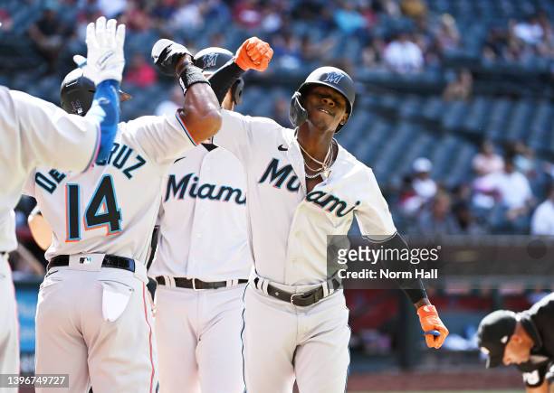 Jazz Chisholm Jr of the Miami Marlins celebrates with Bryan De La Cruz after hitting a three run home run during the ninth inning off of Mark...