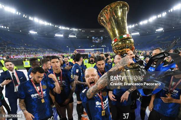 Federico Dimarco of FC Internazionale celebrates with the Coppa Italia Trophy after victory in the Coppa Italia Final match between Juventus and FC...