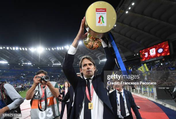 Simone Inzaghi, Head Coach of FC Internazionale celebrates with the Coppa Italia Trophy after victory in the Coppa Italia Final match between...