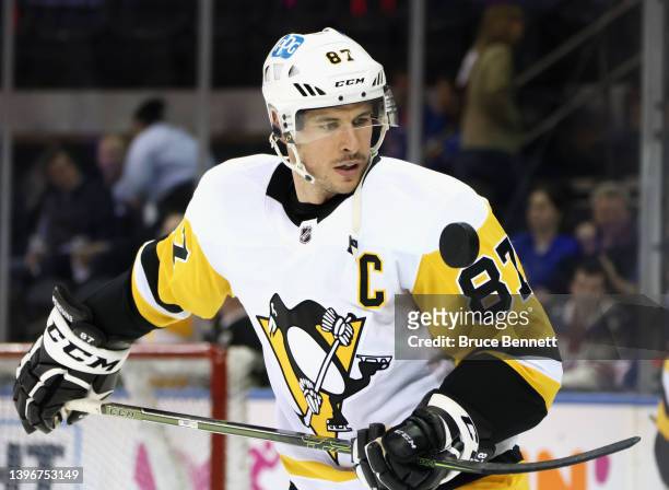 Sidney Crosby of the Pittsburgh Penguins plays with the puck during warm-ups prior to playing against the New York Rangers in Game Five of the First...