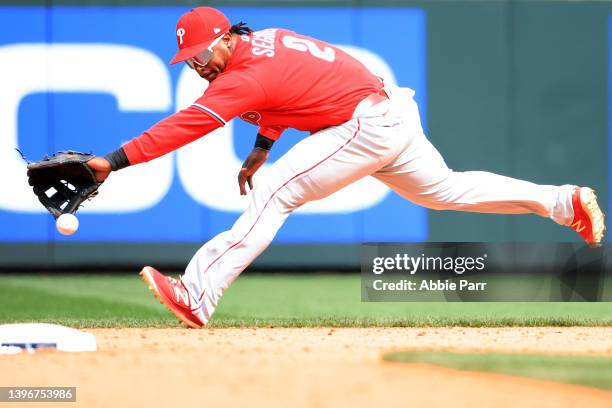 Jean Segura of the Philadelphia Phillies is unable to make the play on a ball off the bat of J.P. Crawford of the Seattle Mariners that went for a...