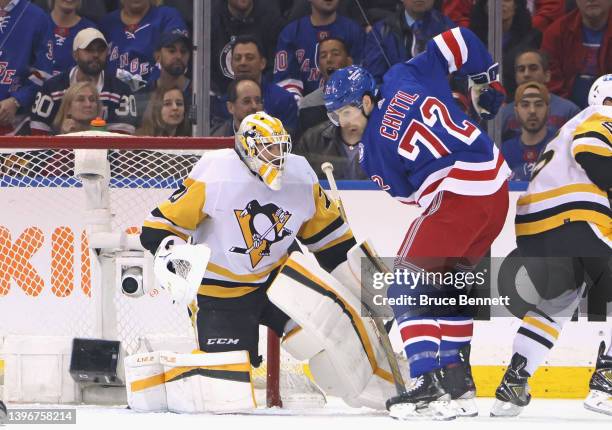 Louis Domingue of the Pittsburgh Penguins defends the net against Filip Chytil of the New York Rangers during the first period in Game Five of the...