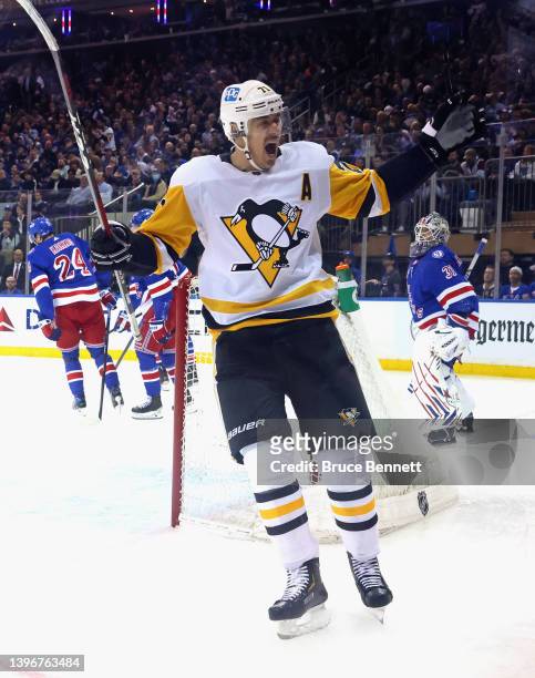 Evgeni Malkin of the Pittsburgh Penguins celebrates a second period goal by Kris Letang against Igor Shesterkin of the New York Rangers in Game Five...