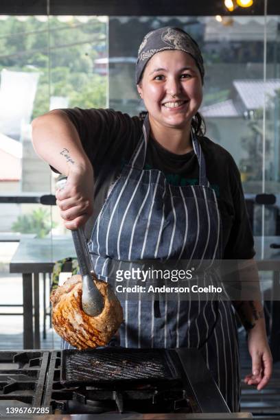 kitchen chef grilling a pork shoulder - pork shoulder stock pictures, royalty-free photos & images
