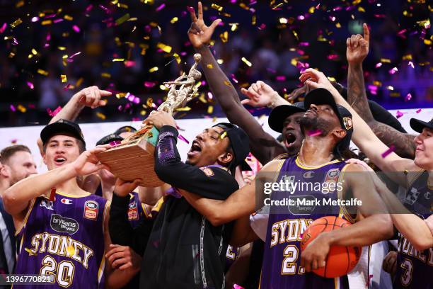 Jaylen Adams of the Kings lift the trophy as the Kings celebrate victory during game three of the NBL Grand Final series between Sydney Kings and...