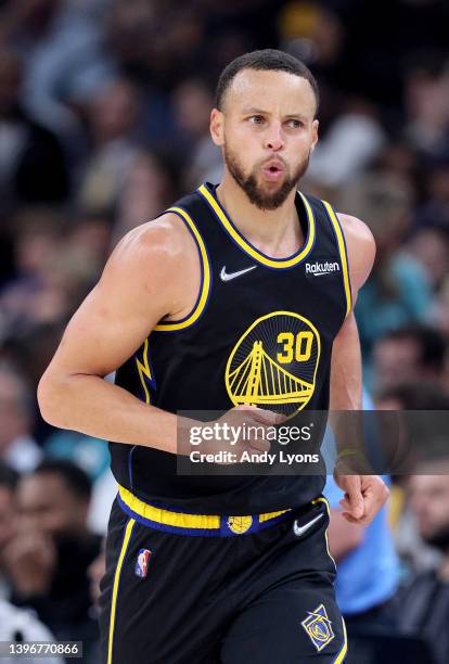 Stephen Curry of the Golden State Warriors celebrates a basket against the Memphis Grizzlies during the first quarter in Game Five of the 2022 NBA...