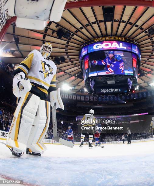 Louis Domingue of the Pittsburgh Penguins looks in the net following the game winning goal by Filip Chytil of the New York Rangers in Game Five of...