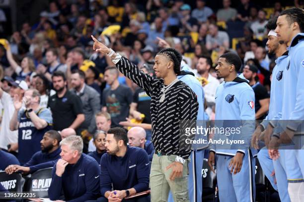 Ja Morant of the Memphis Grizzlies reacts to a basket from the bench against the Golden State Warriors during the first quarter in Game Five of the...