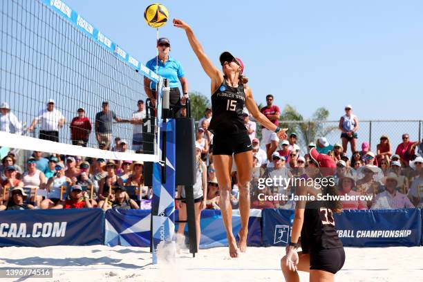 Alaina Chacon of the Florida State Seminoles hits a kill against the USC Trojans during the Division I Women's Beach Volleyball Championship held on...