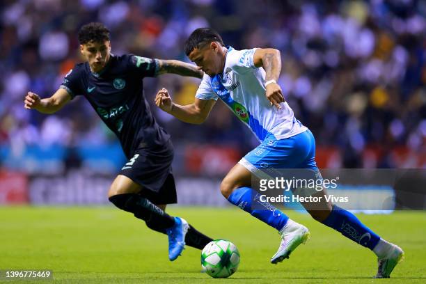 Jorge Sanchez of America competes for the ball with Maximiliano Araujo of Puebla during the quarterfinals first leg match between Puebla and America...
