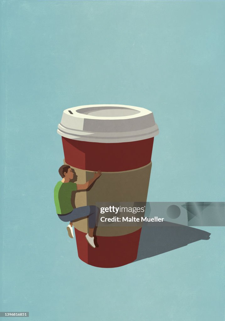 Caffeine addicted man clinging to disposable coffee cup