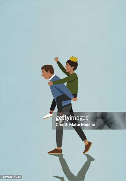 father piggybacking son wearing crown and cheering - piggyback stock illustrations