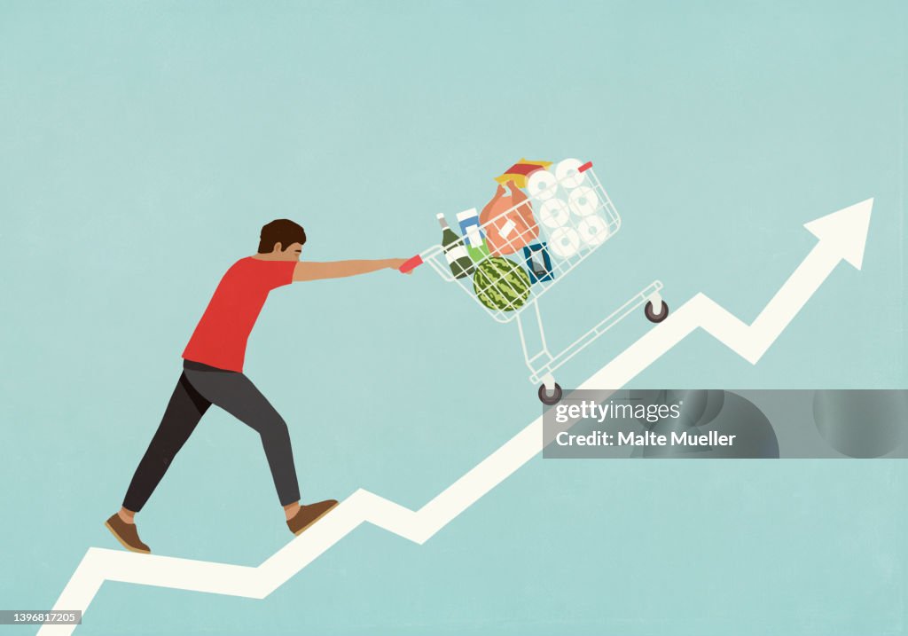 Man pushing shopping cart of groceries up line chart arrow