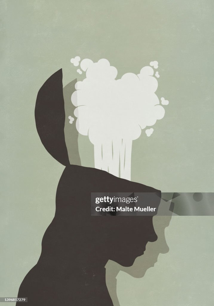 Exploding brain of silhouetted profile