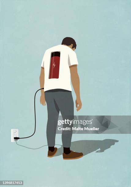 man charging battery in back with plug, standing at electric outlet - erschöpft stock-grafiken, -clipart, -cartoons und -symbole