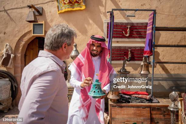 middle eastern craft merchant selling incense burner - arabic ornament stock pictures, royalty-free photos & images