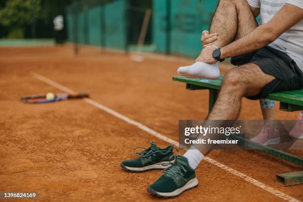 sports injury - young tennis player stock pictures, royalty-free photos & images