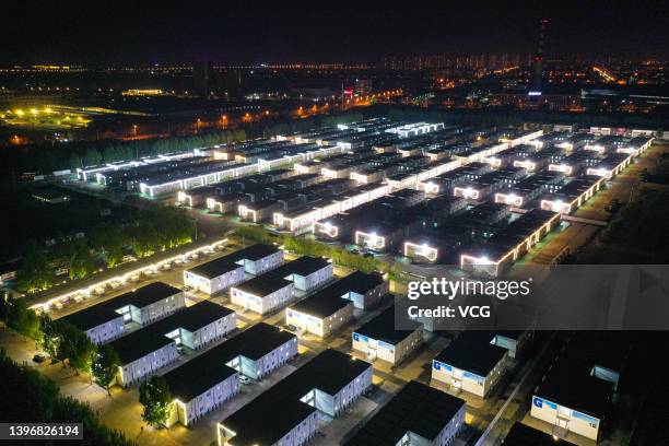 Aerial view of a makeshift hospital at Shenyang International Exhibition Center at night on May 11, 2022 in Shenyang, Liaoning Province of China. The...