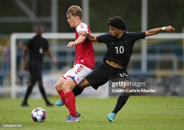 Daniel Haarbo of Denmark is challenged by Youssef Amyn of Germany during the international friendly match between Denmark U19 and Germany U19 at DS...