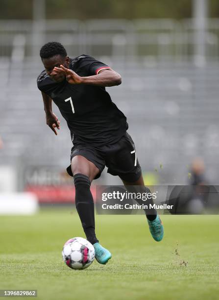 Kwadwo Baah of Germany runs with the ball during the international friendly match between Denmark U19 and Germany U19 at DS Arena on May 11, 2022 in...