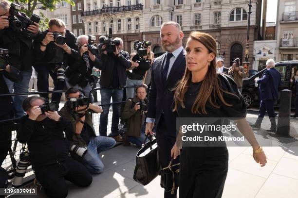 Coleen Rooney arrives with husband Wayne Rooney at Royal Courts of Justice, Strand on May 12, 2022 in London, England. Coleen Rooney, wife of Derby...