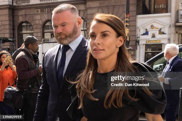 Coleen Rooney arrives with husband Wayne Rooney at Royal Courts of Justice, Strand on May 12, 2022 in London, England. Coleen Rooney, wife of Derby...