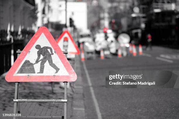 road signs work in progress - road construction stock pictures, royalty-free photos & images