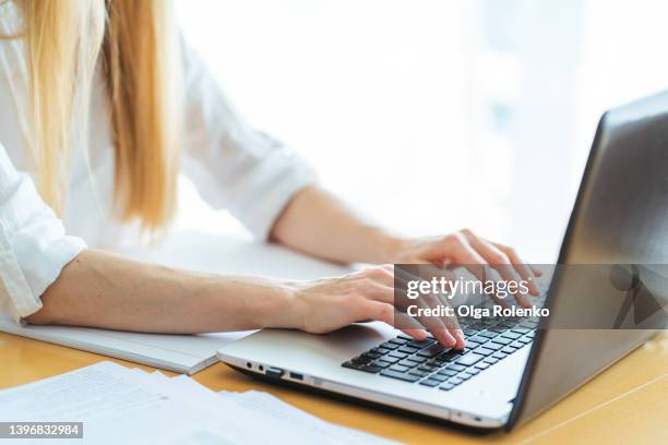 woman hands using laptop at office. start new business - reconversion photos et images de collection