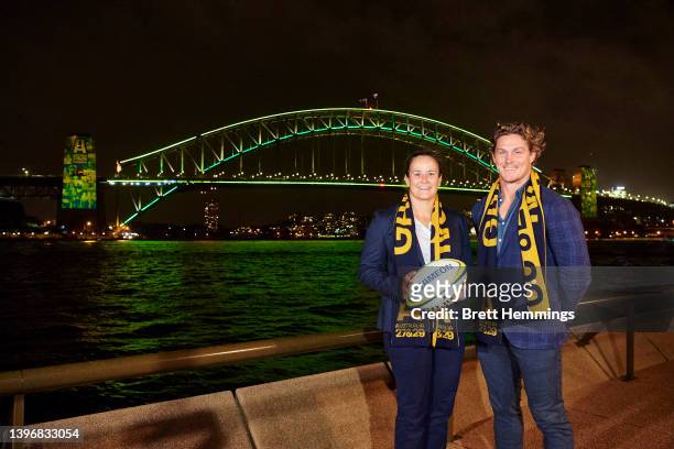 Michael Hooper and Shannon Parry pose for a photo in front of The Sydney Harbour Bridge, lit in support of Rugby Australia's 2027 & 2029 Rugby World...