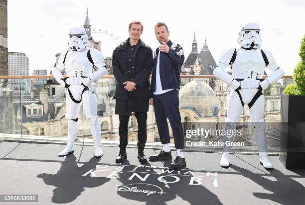 Hayden Christensen and Ewan McGregor pose with Stormtroopers as they attend the "Obi-Wan Kenobi" photocall at the Corinthia Hotel London on May 12,...