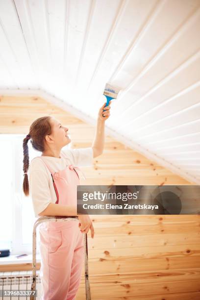 girl paints the ceiling - welfare reform stock pictures, royalty-free photos & images
